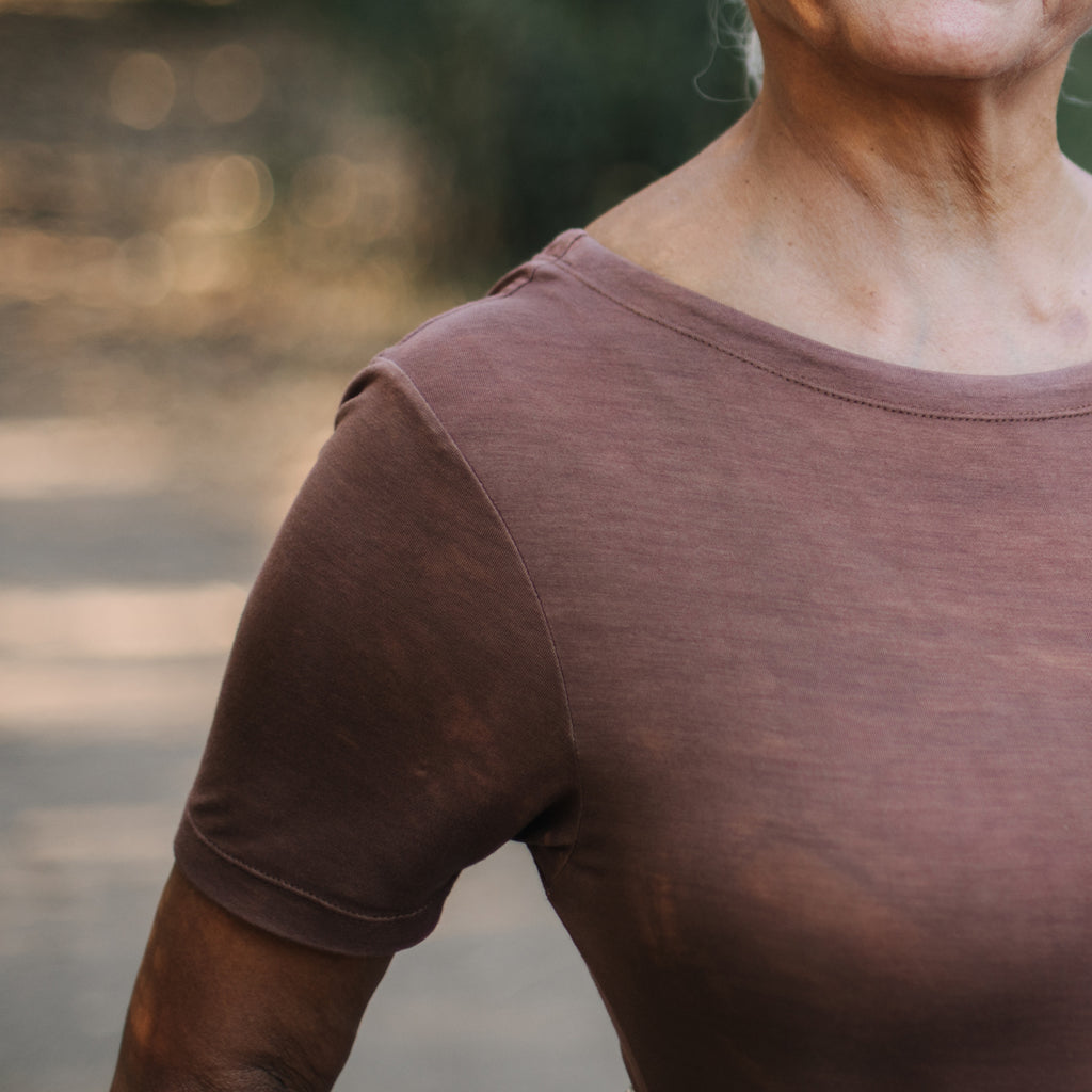 Detail of Sakti Rising Tara Tee in Cacao, ethical sustainable yoga apparel. 