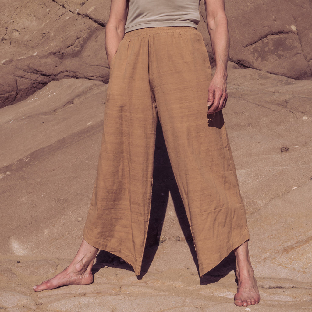 Woman standing in wide-leg stance wearing Sakti Rising Durga Pants. Ecofriendly sustainable yoga apparel that gives back to marginalized communities around the world.